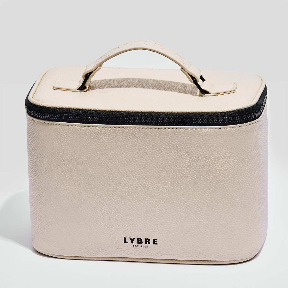 The Carry All lash train case by Lybre Lashes — structured lychee-textured PVC exterior with carrying handle and zippered closure