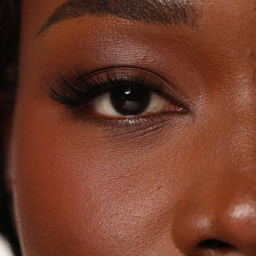 Applying No. 1 natural strip lashes with flexible band for easy placement