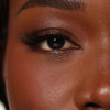 Applying No. 1 natural strip lashes with flexible band for easy placement